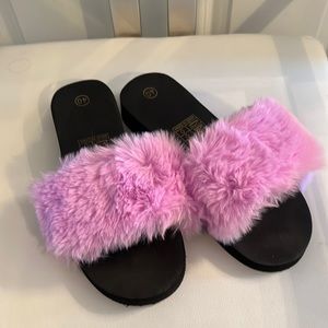 Ladies slippers in a fun periwinkle color never been worn